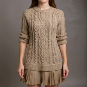 Beige cable knit sweater dress worn by a person on a gray background