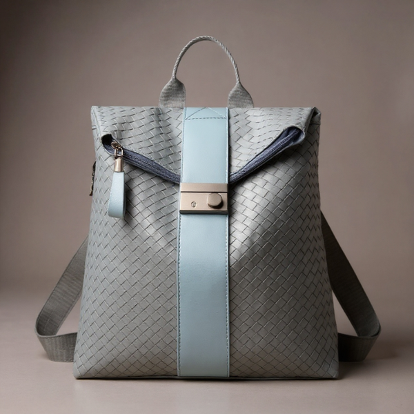 Gray woven backpack with a light blue strap on a beige background