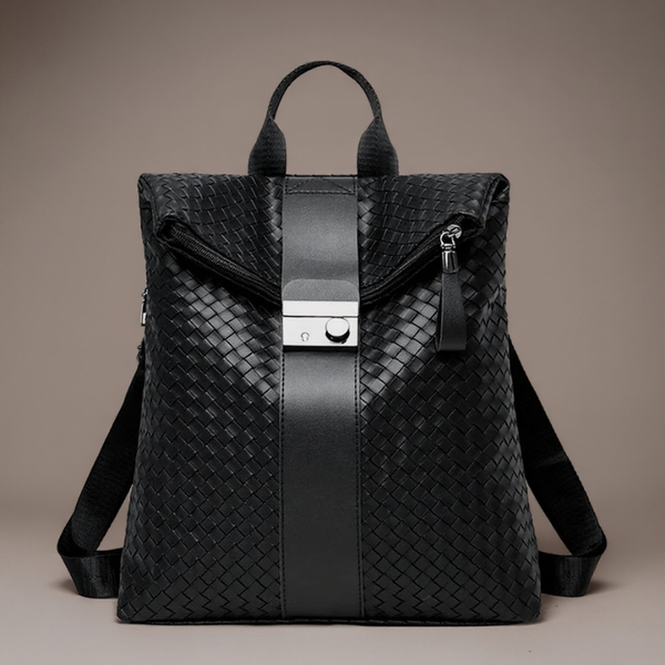 Black woven backpack with a silver buckle on a beige background