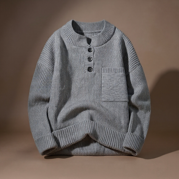 Gray knitted sweater with button details on a brown background