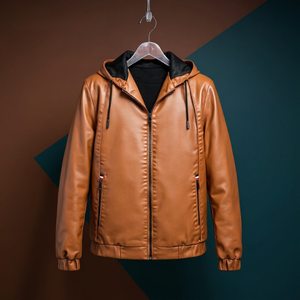 Brown leather jacket on a hanger against a two-tone background