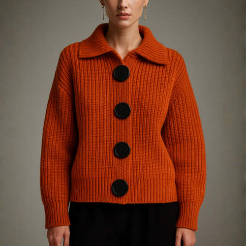 Orange knitted sweater with black buttons on a gray background