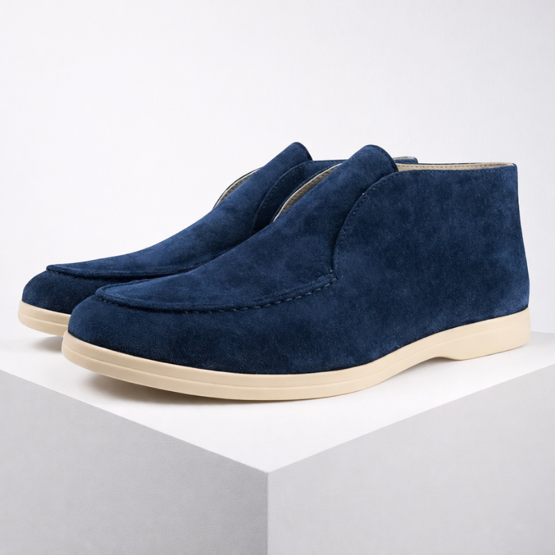 Pair of blue suede shoes on a white background