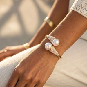 Pearl bracelet on a wrist with a blurred background