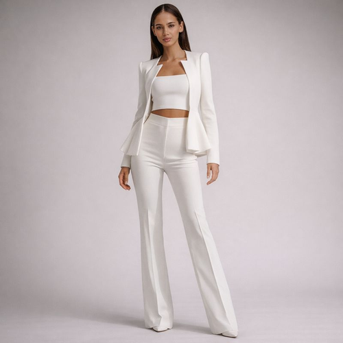 Woman wearing a white outfit on a plain background