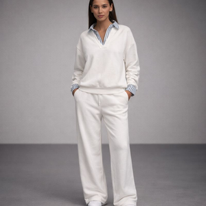 Woman wearing a white outfit with a gray background