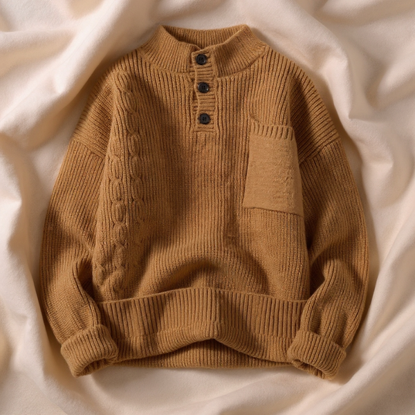 Brown knitted sweater with buttons on a beige fabric background