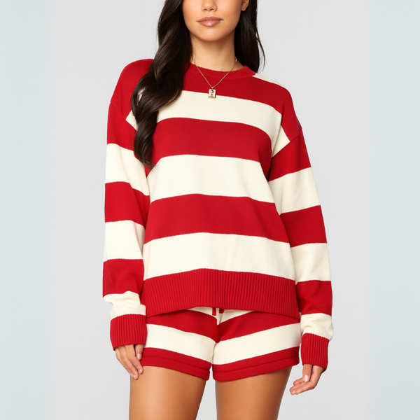 Person wearing a red and white striped sweater and shorts set on a plain background