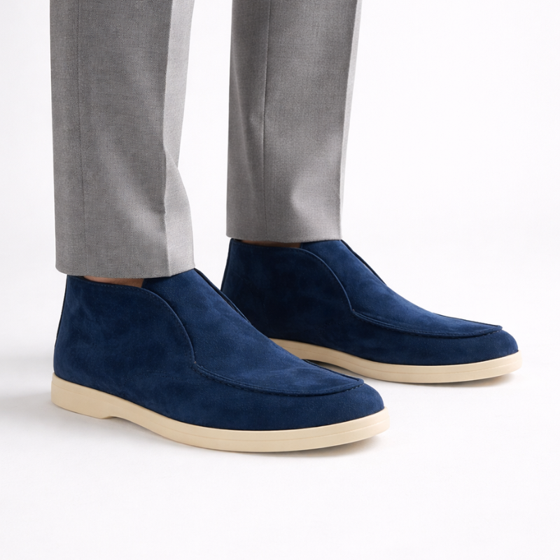 Pair of blue suede shoes on a white background