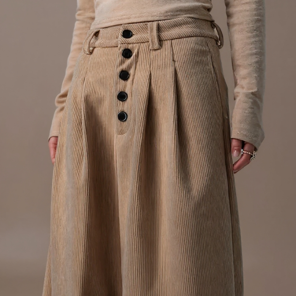 Beige corduroy skirt with button details on a neutral background