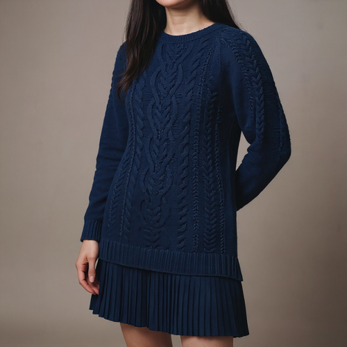 Navy blue cable knit sweater dress worn by a person on a brown background