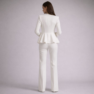 Woman wearing a white suit on a light purple background