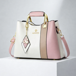 Women's white leather handbag close-up — everyday — Janenovo Butterfly Handbag — Sonverdano