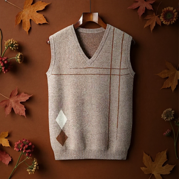 Brown argyle sweater vest on a hanger with autumn leaves and flowers on a brown background