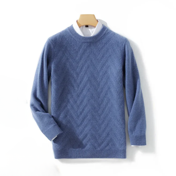 Blue sweater with a zigzag pattern on a wooden hanger against a white background