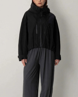 Women's black jacket close-up — outerwear — Margot Cropped Hooded Rain Jacket — Sonverdano