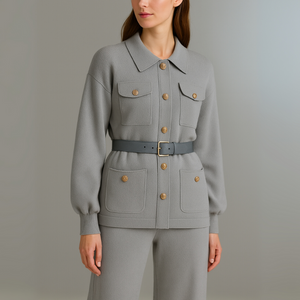 Gray jacket with button details worn by a person on a plain background
