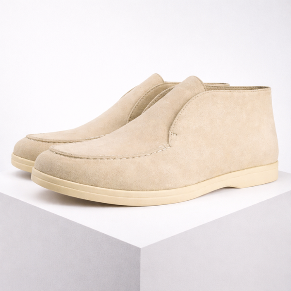 Beige slip-on shoes on a white background