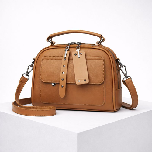 Brown handbag with a strap on a white background