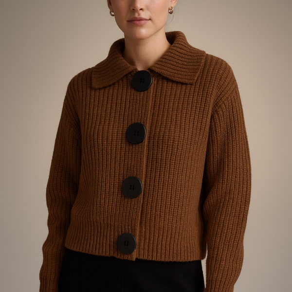 Brown knitted jacket with black buttons on a neutral background