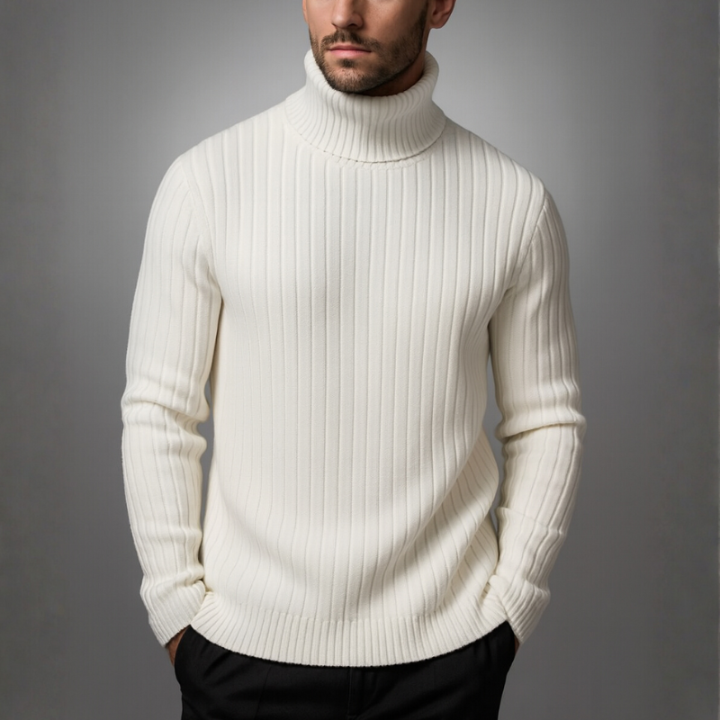 Man wearing a white turtleneck sweater against a gray background
