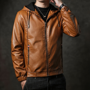 Brown leather jacket worn by a person on a dark background