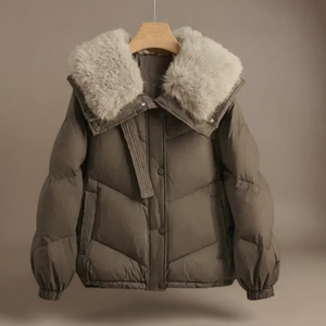 Brown puffer jacket with fur-lined hood on a mannequin against a beige background