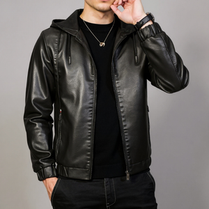 Person wearing a black leather jacket on a gray background