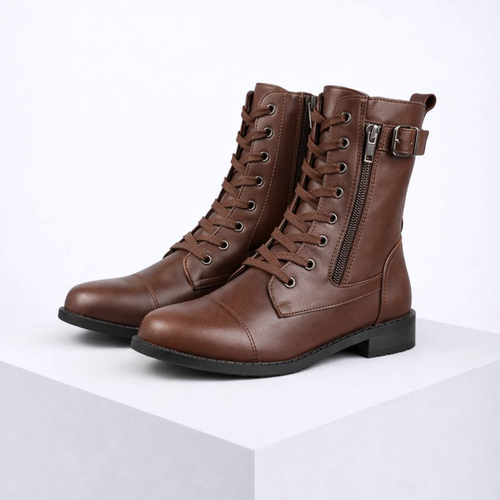 Pair of brown leather boots with zippers on a white background