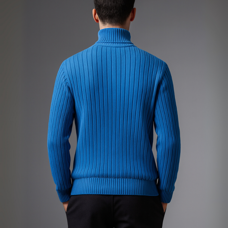 Man wearing a white turtleneck sweater against a gray background