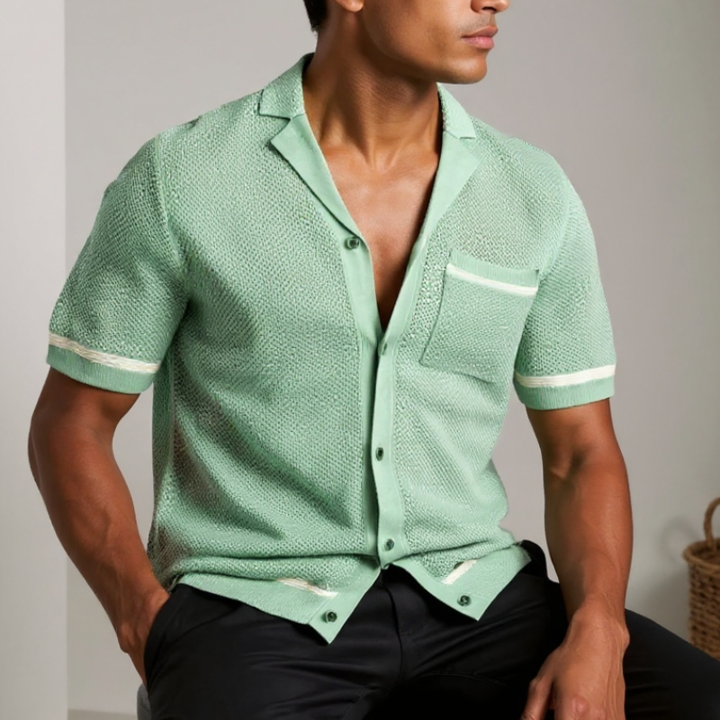 Man wearing a blue textured shirt with white accents on a brown background