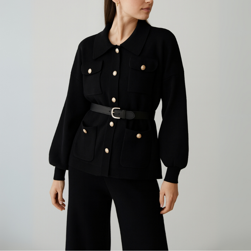 Gray jacket with button details worn by a person on a plain background