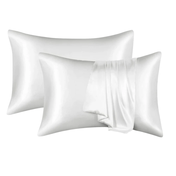 Two white satin pillowcases on a white background