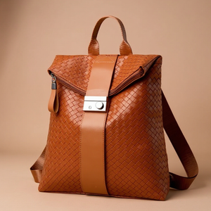 Brown woven leather backpack on a beige background