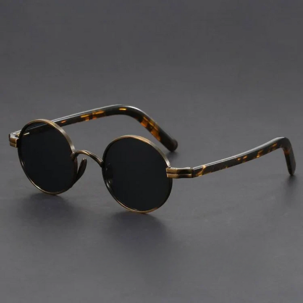 Round sunglasses with tortoiseshell frame on a dark gray background