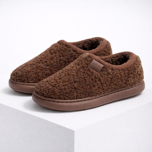 Pair of brown slippers on a white background