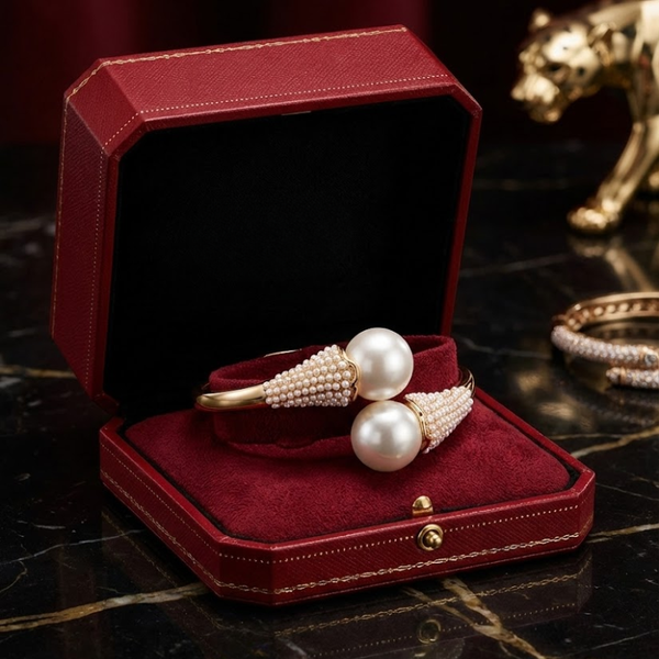 Pearl bracelet in a red jewelry box on a dark surface