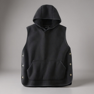 Black hooded vest with button details on a gray background