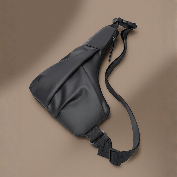 Black sling bag on a brown background