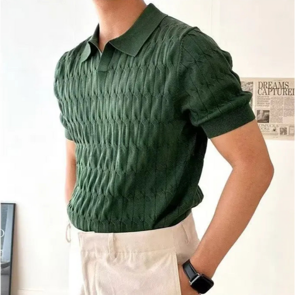 Person wearing a green knitted polo shirt with a white background