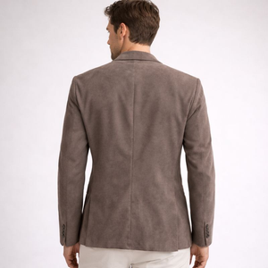 Man wearing a brown suede jacket on a white background