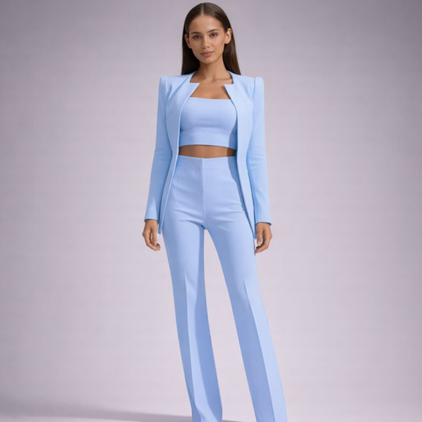 Woman wearing a light blue outfit on a gray background