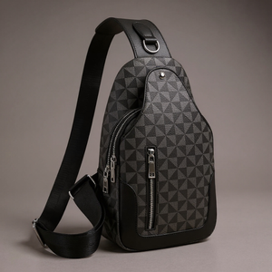 Black and gray geometric patterned sling bag on a gray background