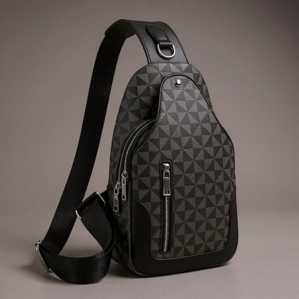 Black and gray geometric patterned sling bag on a gray background