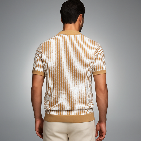 Man wearing a striped shirt and beige pants against a gray background