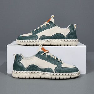 Green and white sneakers on a gray background