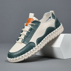 Green and white sneaker on a gray background