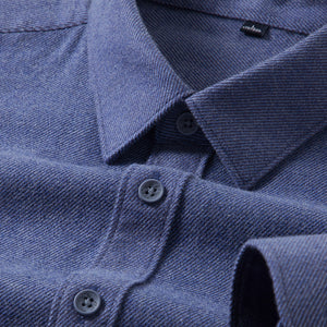 Close-up of a blue shirt with collar and buttons