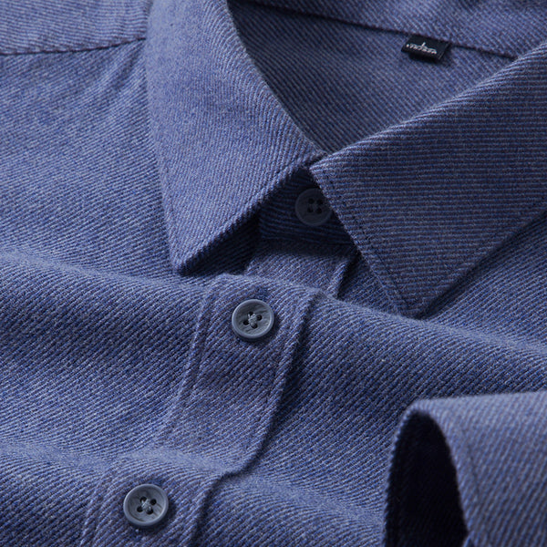 Close-up of a blue shirt with collar and buttons