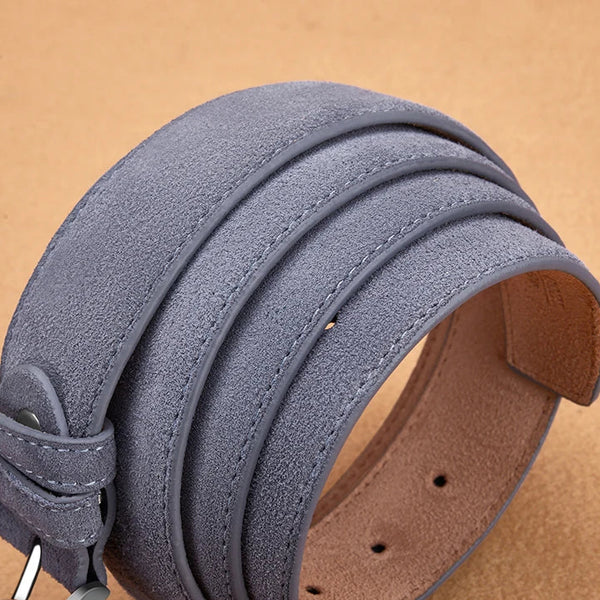 Close-up of a gray suede leather belt on a beige background